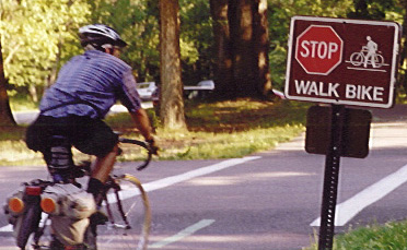 Walk Bike sign on dangerous bike path